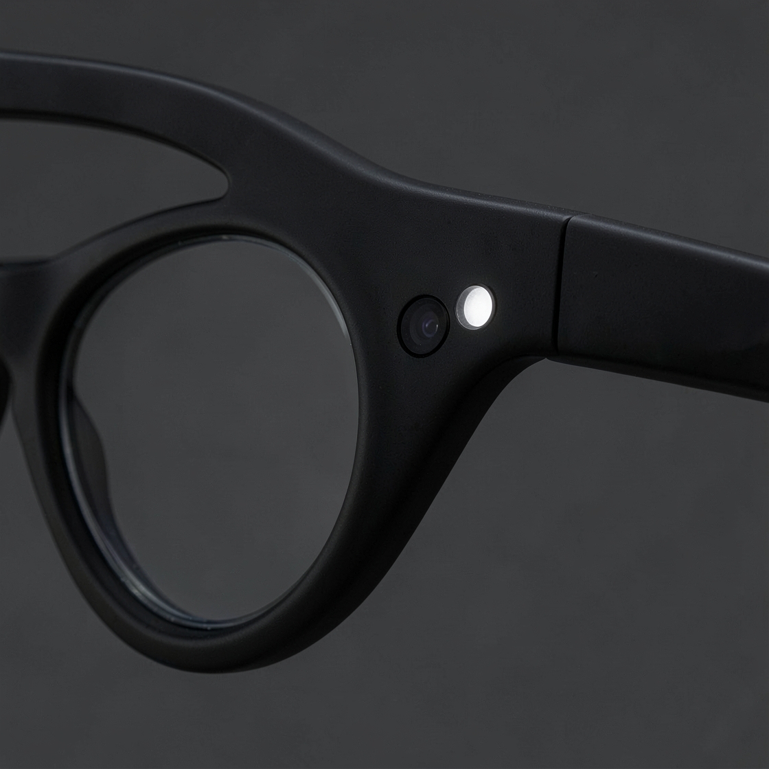 Unbranded smart glasses with a visible capture light in a controlled studio scene