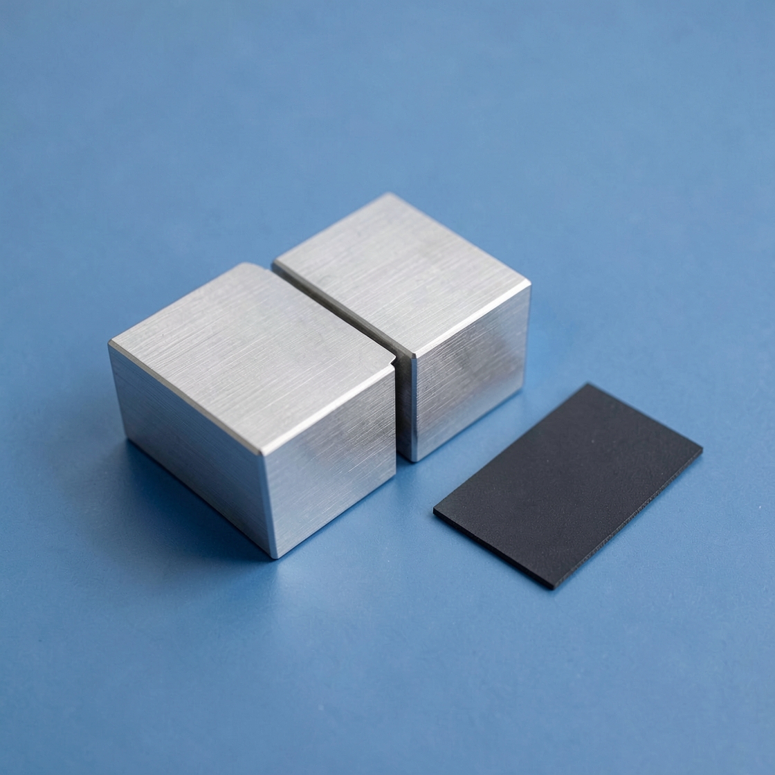 Aluminum blocks and a silicon wafer illustrating software reliability and maintenance
